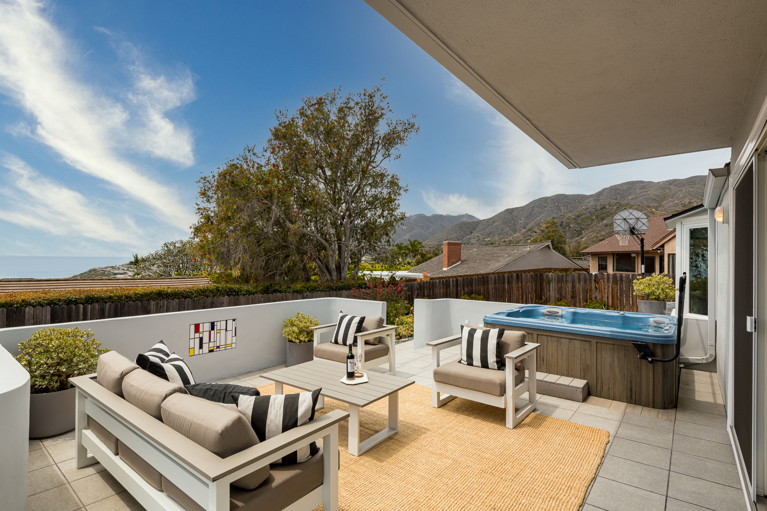 Patio entertaining area with view of mountains and ocean
