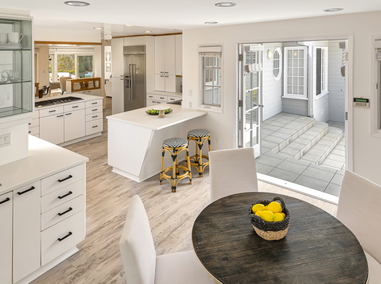 bright modern kitchen and dining area with french doors leading outside