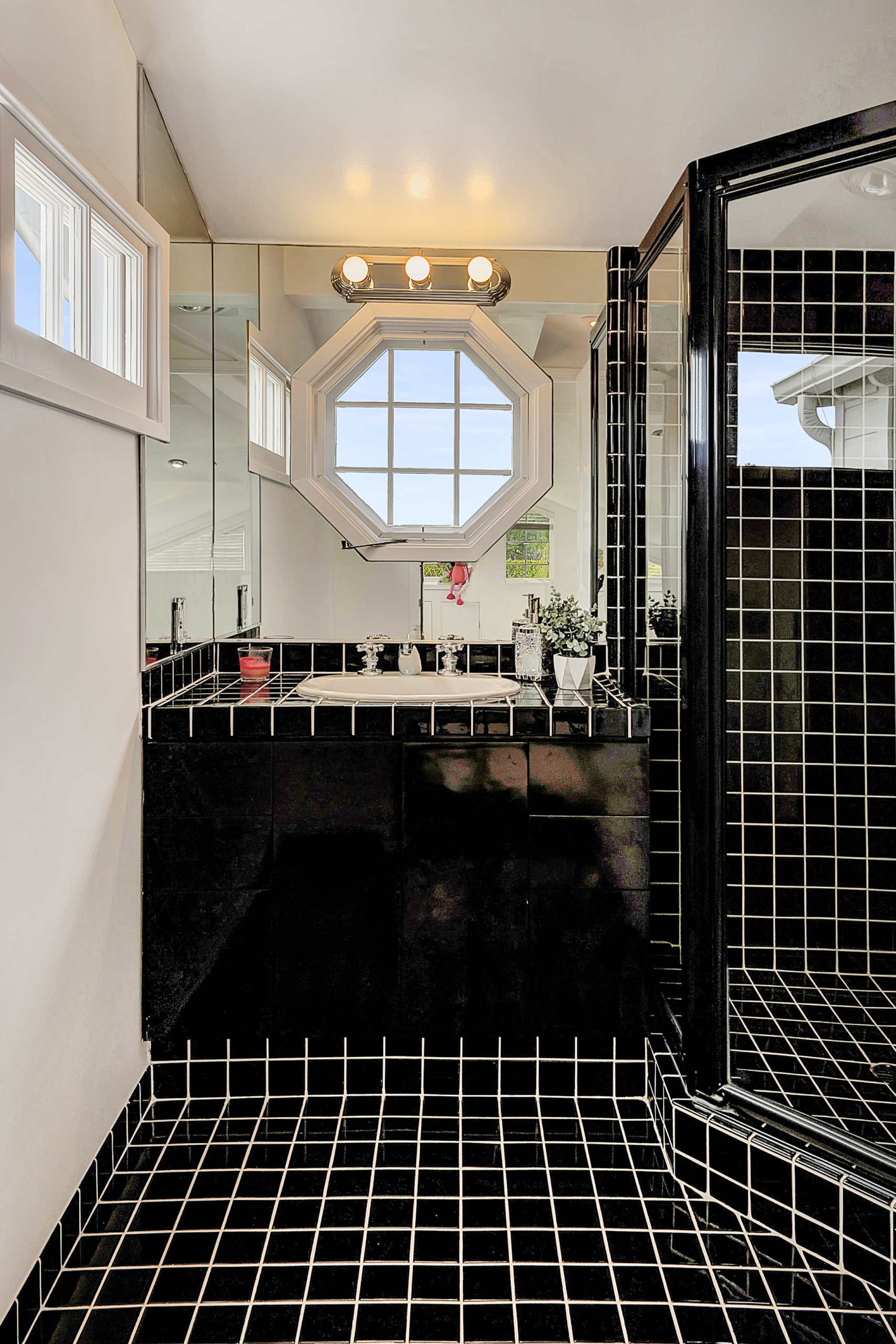 mostly black tile bathroom with shower