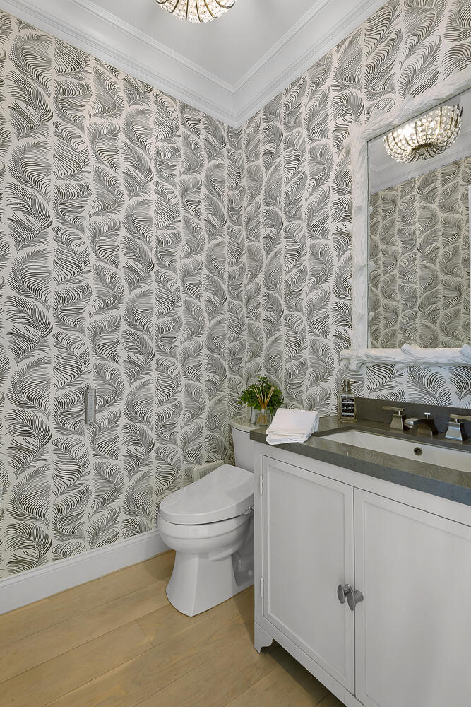 Black and white Wallpapered powder room