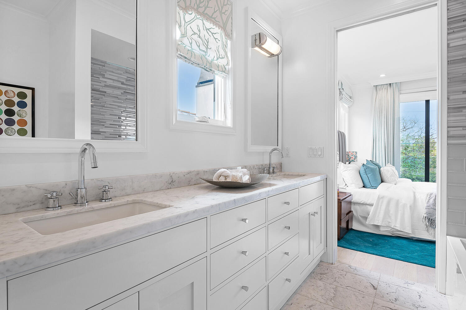 Mostly white bathroom with large two-sink vanity