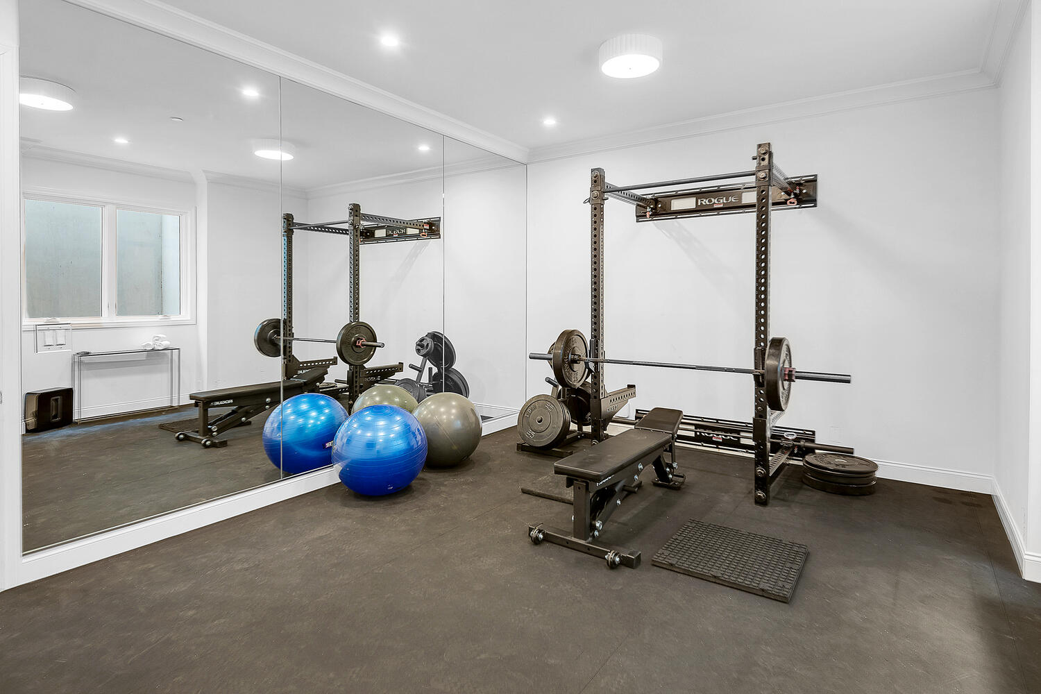 Home gym and large floor-to-ceiling mirrors