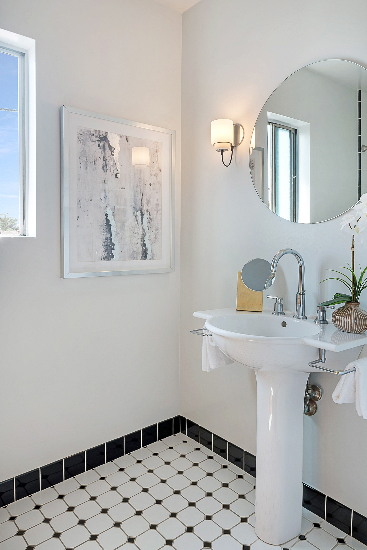 lack and white bathroom with pedestal sink