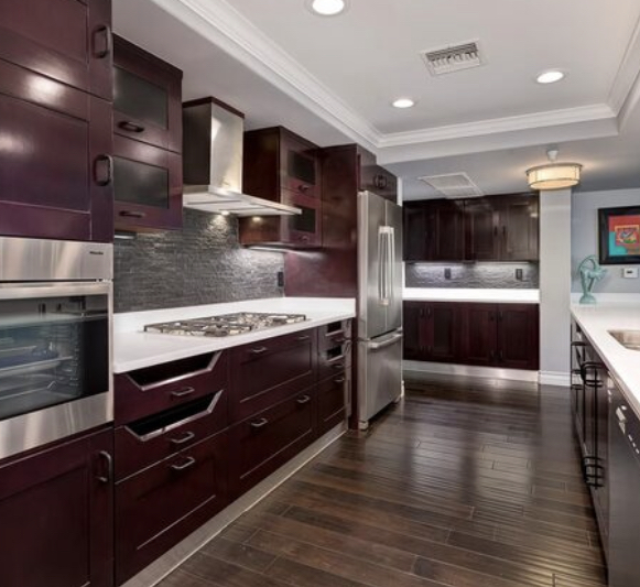 Kitchen with modern dark cabinets and stainless appliancesin
