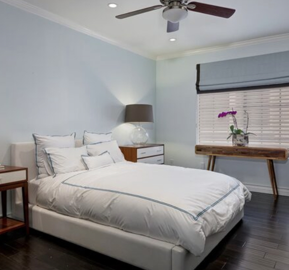 Bedroom with window and ceiling fan