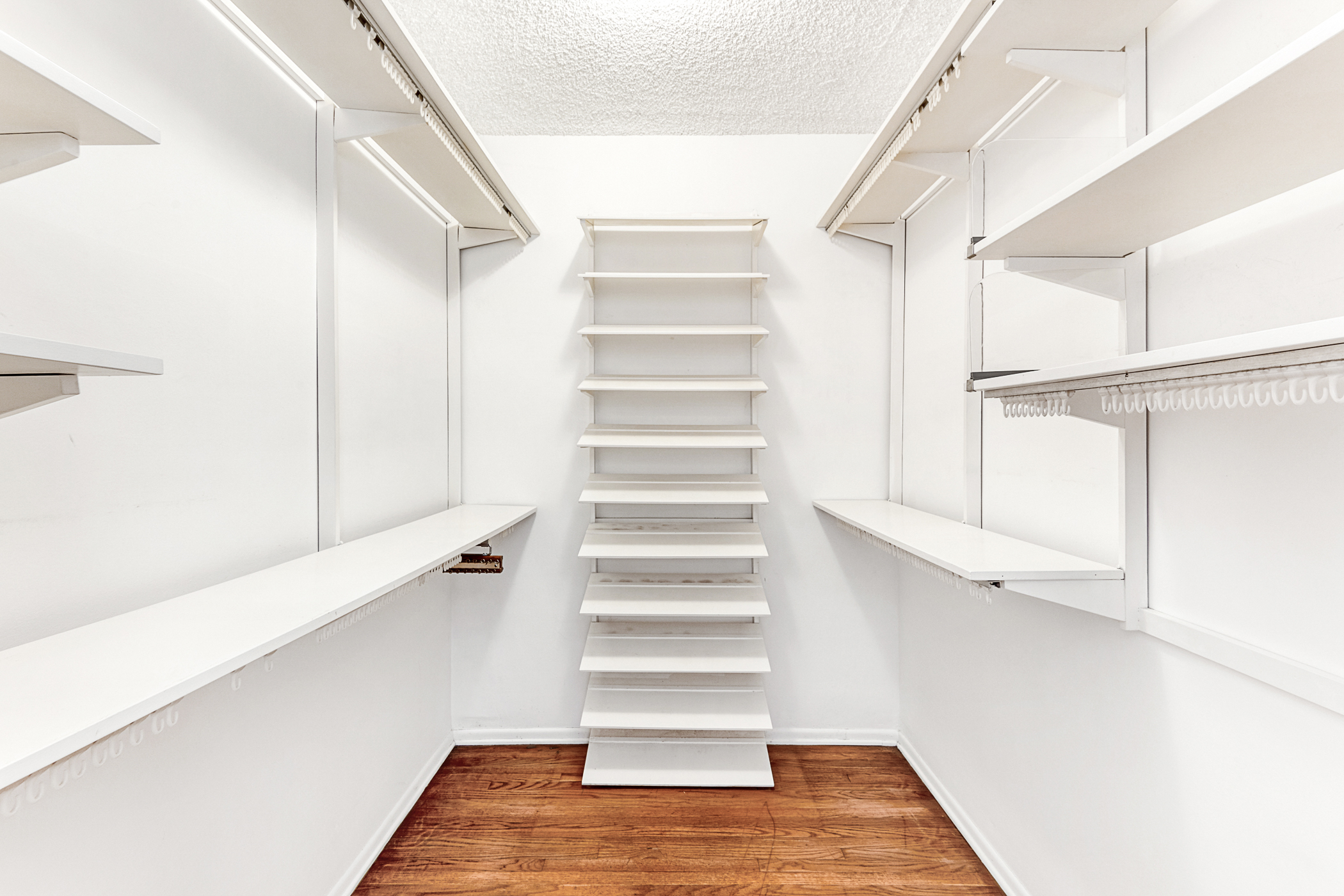 Large walk-in closet with shelving