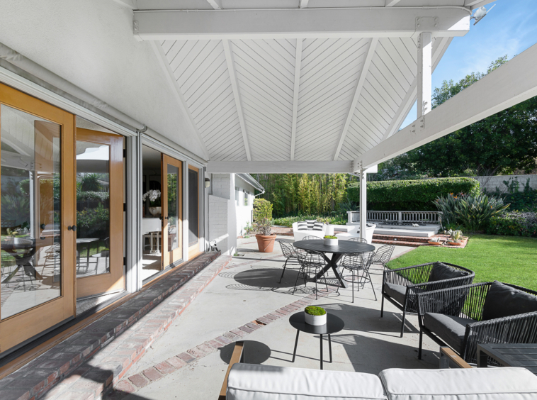 Chevron patterned white roof over patio space at the back of the house