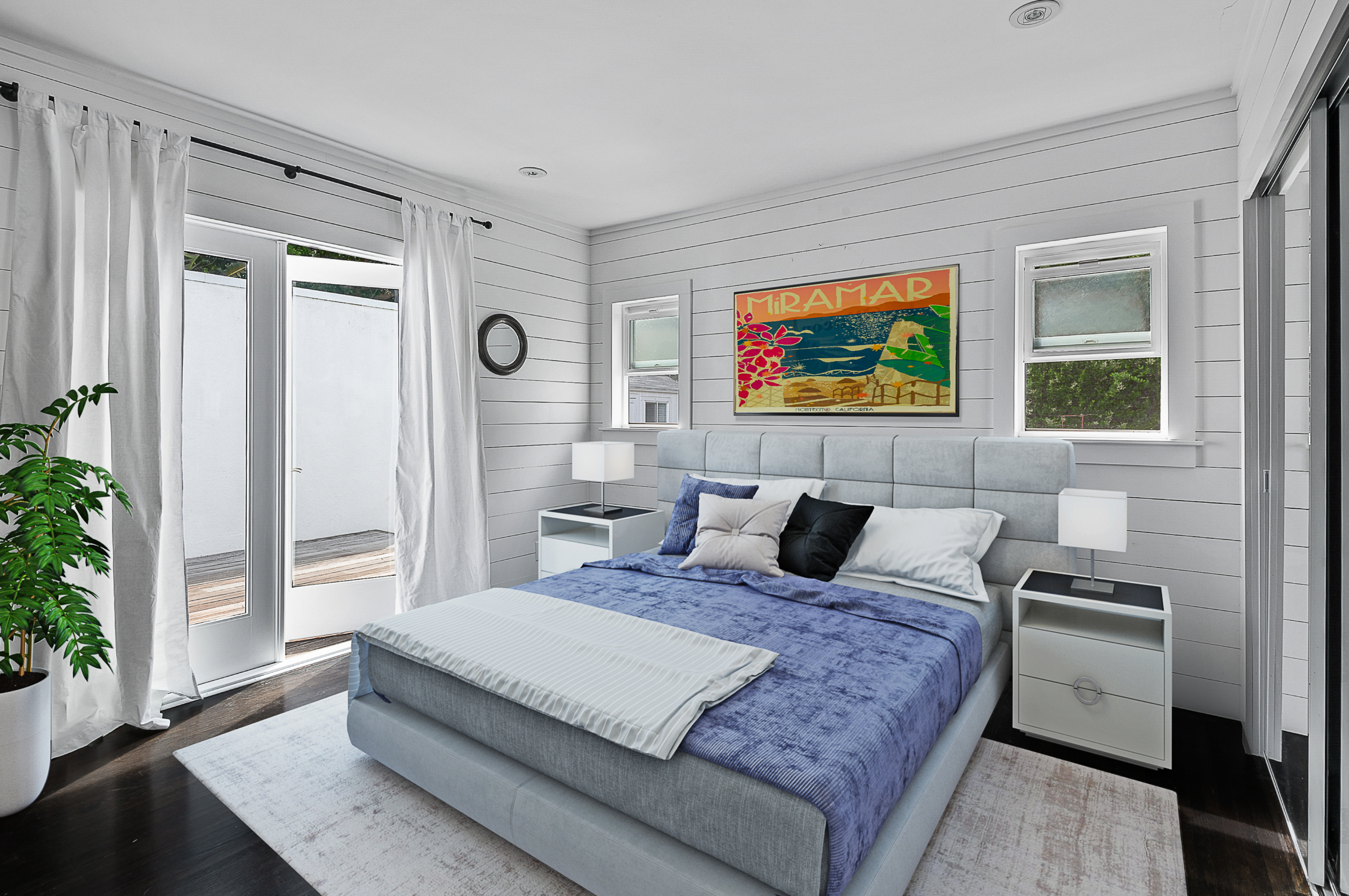 Bright white bedroom with shiplap white walls, dark flooring and glass doors to patio