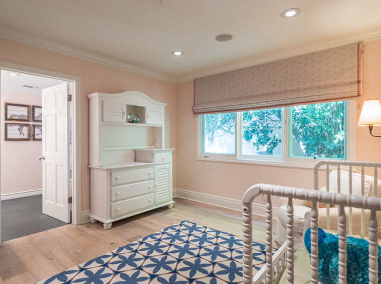 Baby's room with crib and dressing table