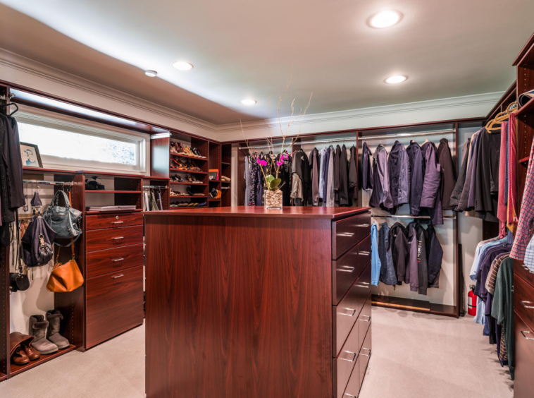 Large walk-in closet with dresser and ample space