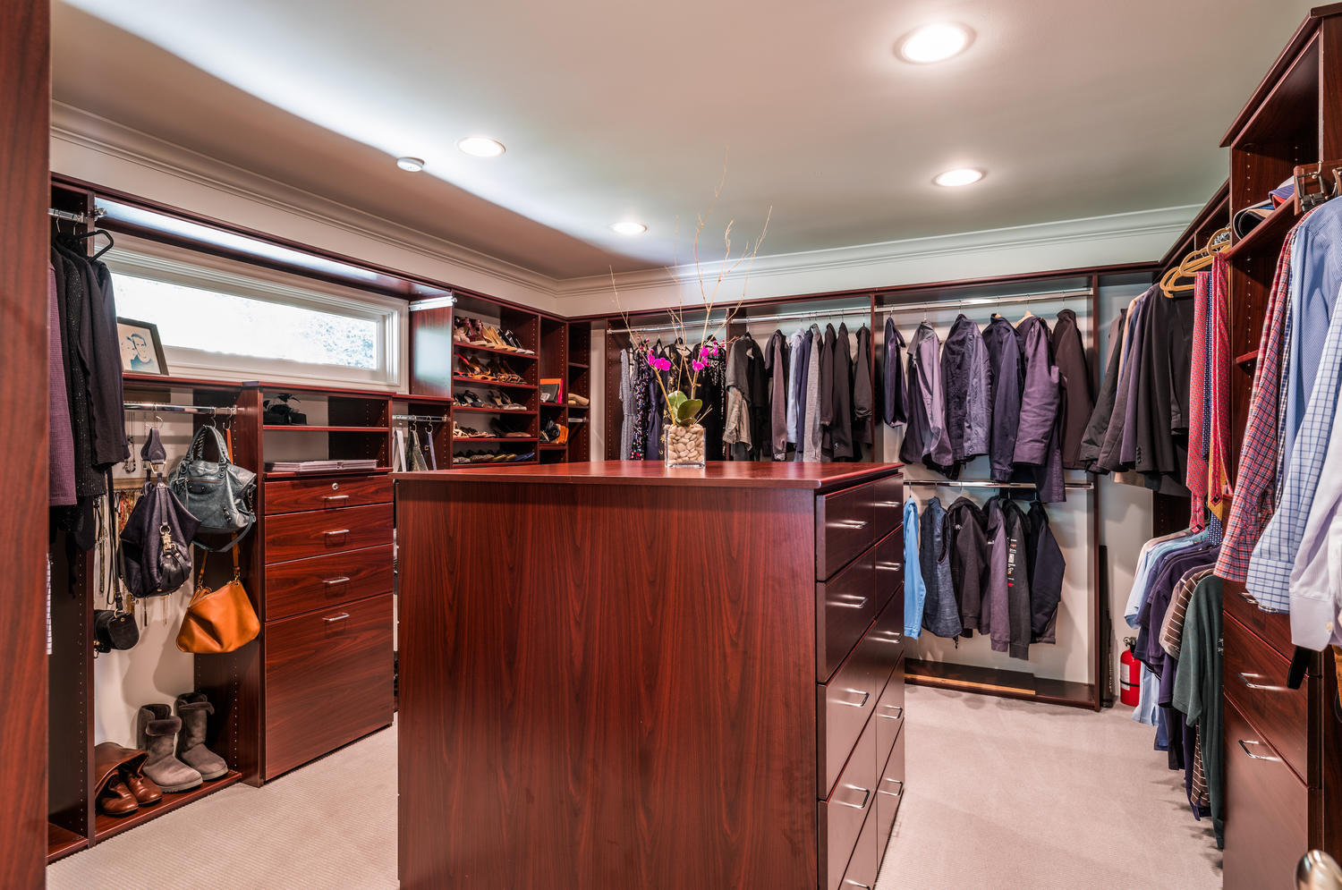 Large walk-in closet with dresser and ample space