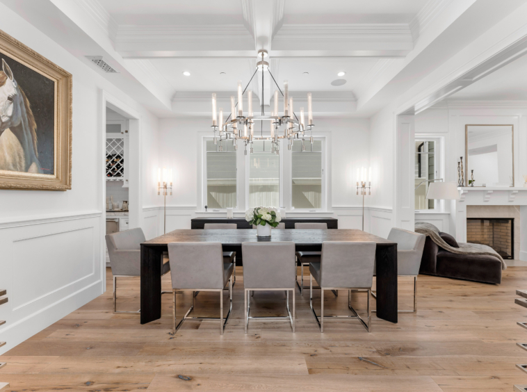 bright white dining area with chandelier and recessed ceiling