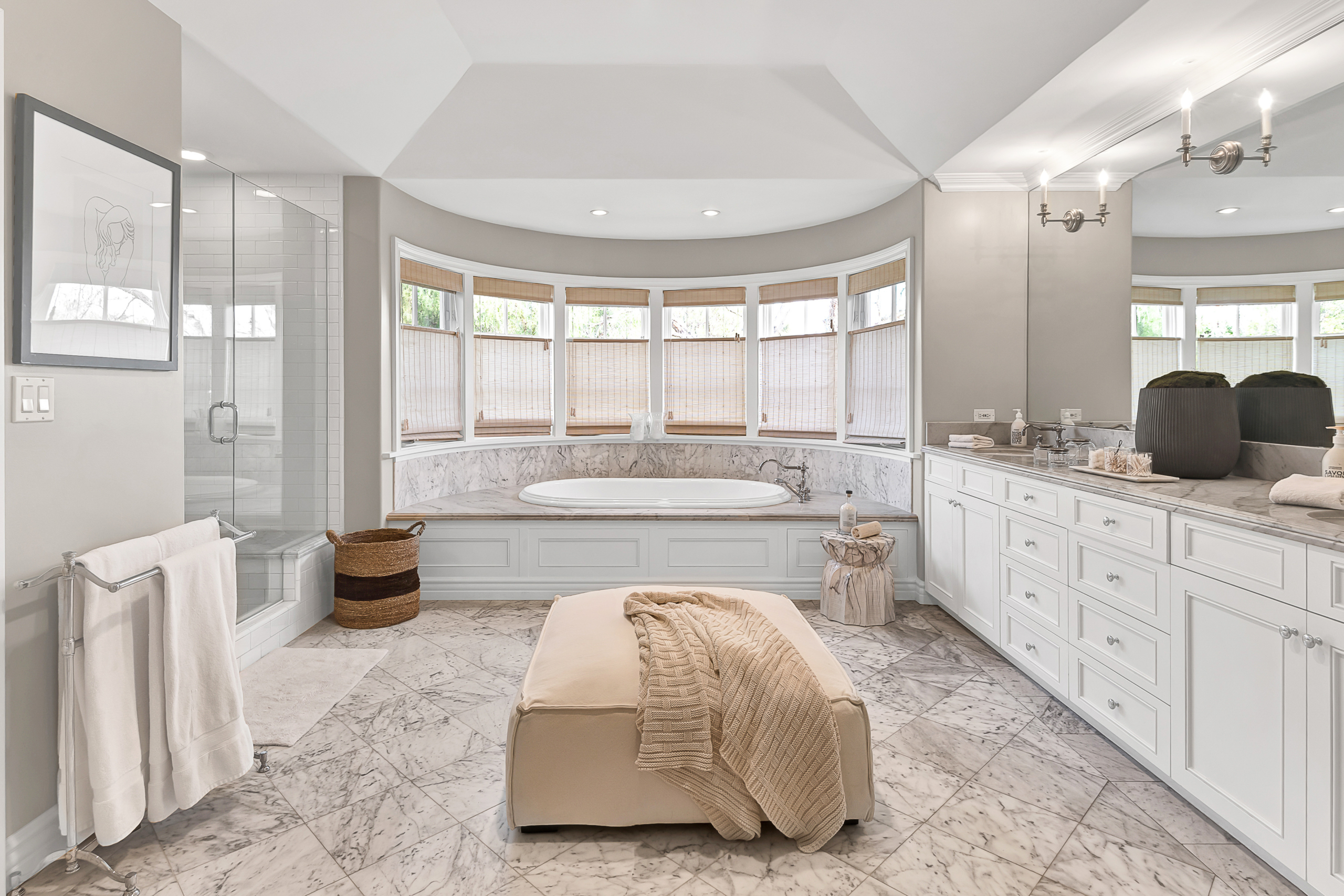 Highly sought-after Ken Ungar designed Quintessential Cape Cod in Brentwood CA. Bright white master bathroom with large soaker tub, separate glass, door shower and marble floors.
