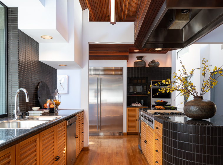 Chef's kitchen and breakfast nook is succinctly placed in the heart of the house, offering easy access to the Dining Room and entertainment spaces.