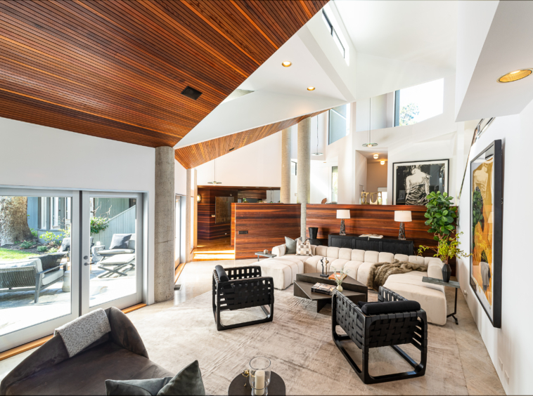 Architectural white and wood Mid Century Modern lincluding the massive two-story Living Room