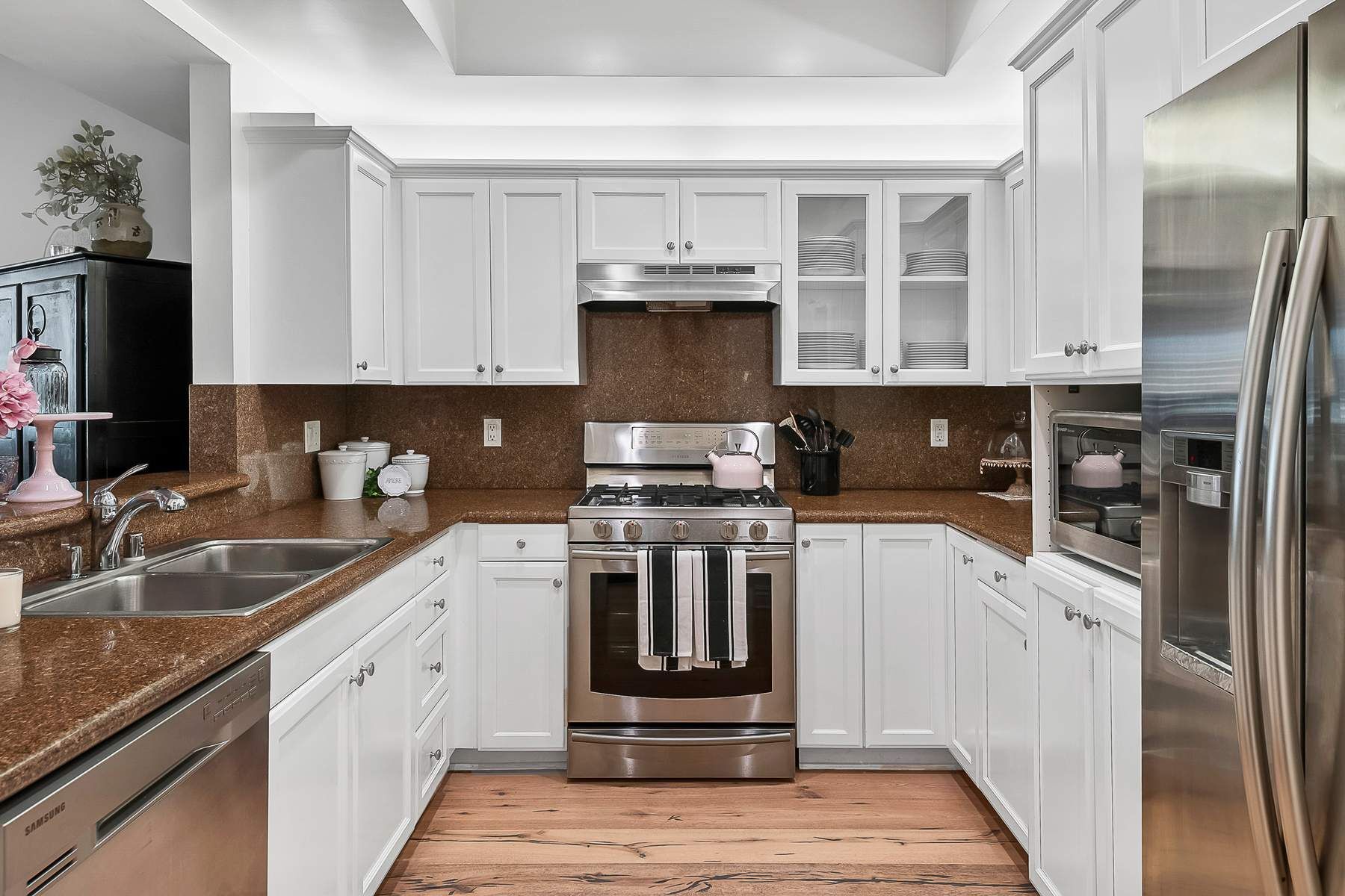 The Chef’s Kitchen comes complete with stainless appliances & breakfast bar.