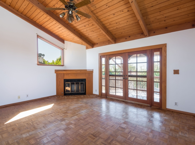 367 N GRENOLA Living Room with wood vaulted ceiling, parquet flooring and fireplace