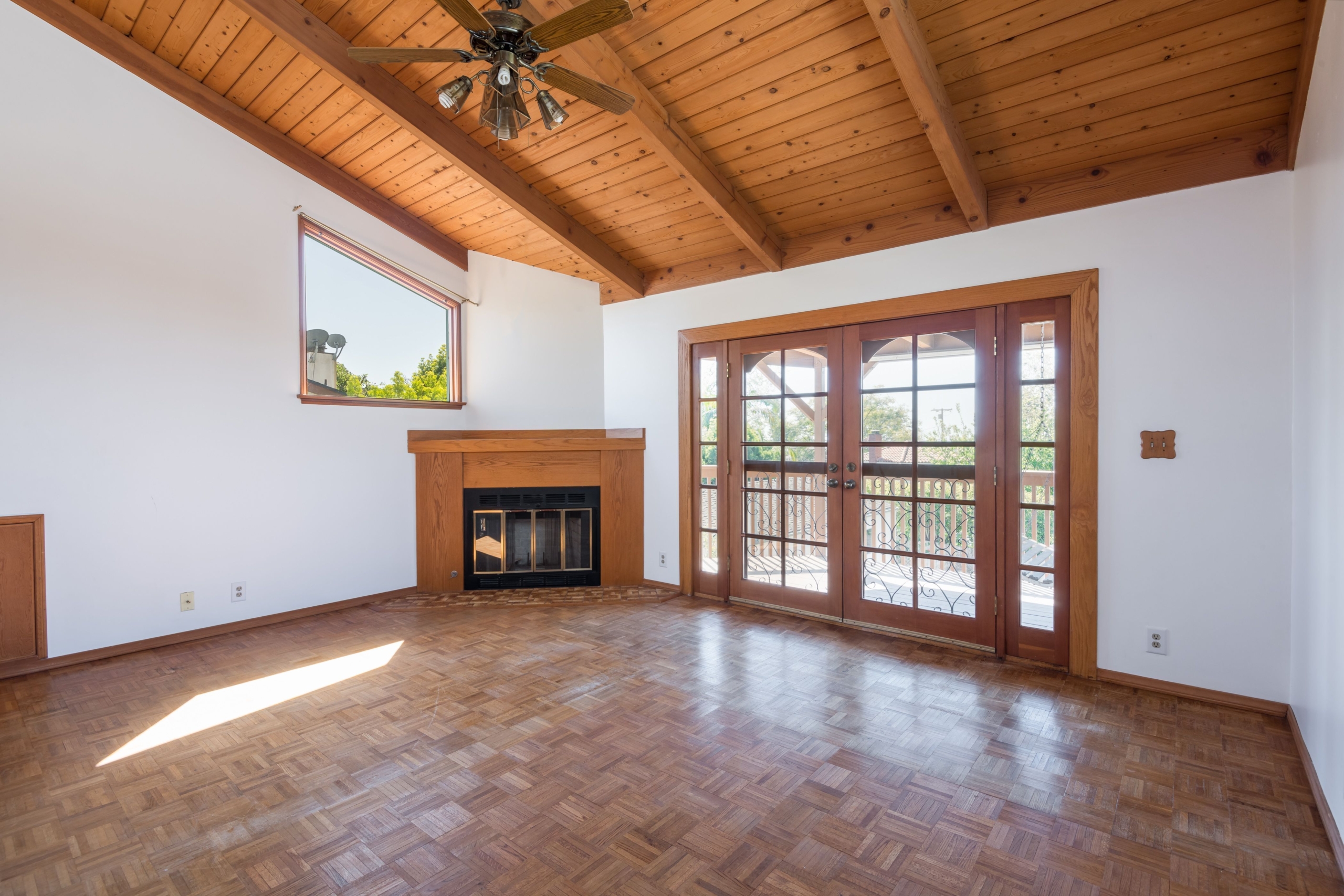 367 N GRENOLA Living Room with wood vaulted ceiling, parquet flooring and fireplace