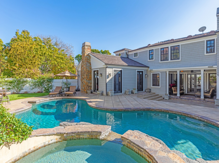 Gorgeous home and pool with large masonry patio