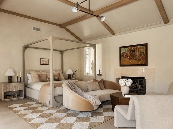 Luxury., Neutral bedroom with vaulted ceiling.