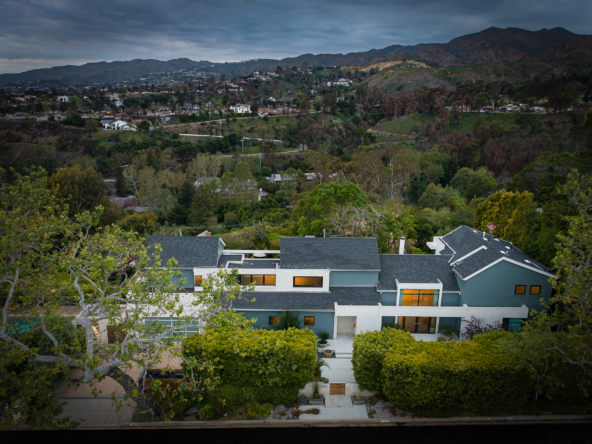 Aerial view of a modern home in the Pacific Palisades hills.