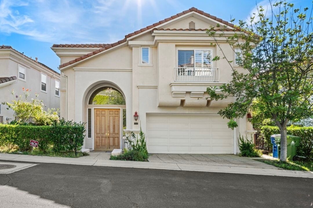 Paseo de Oro , Pacific Palisades Spanish Style 2-story home with attached garage and arched entry