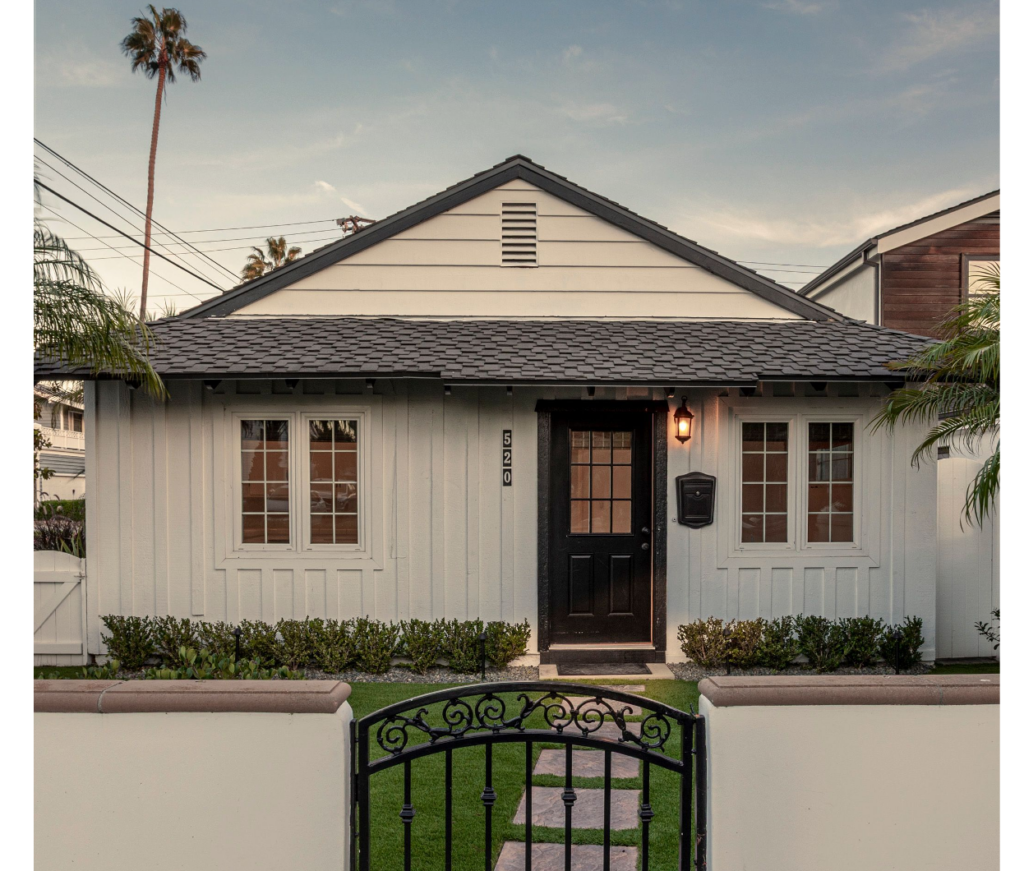 520 MARIGOLD AVE | CORONA DEL MAR front of white home behind white wall and iron gate.